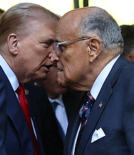 Former President Donald Trump and former NYC Mayor Rudy Giuliani shake hands as they attend the annual 9/11 Commemoration Ceremony at the National 9/11 Memorial and Museum on September 11 in New York City./Getty Images