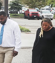 Wavie Jones, a former Central State Hospital employee, returns to Dinwiddie County Courthouse after a break on Monday, Sept. 30. Jones, accompanied by an unidentified woman. Jones was acquitted of involuntary manslaughter charges in the death of 28-year-old Irvo Otieno, on Thursday. Otieno died during a mental health crisis in March 2023 at Central State Hospital.