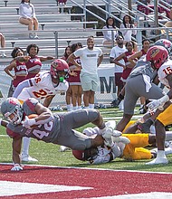Fullback Jaehlan Joyner (42) dives into the end zone for a touchdown. The Virginia Union Panthers would go on to defeat the Shaw University Bears 42-7.