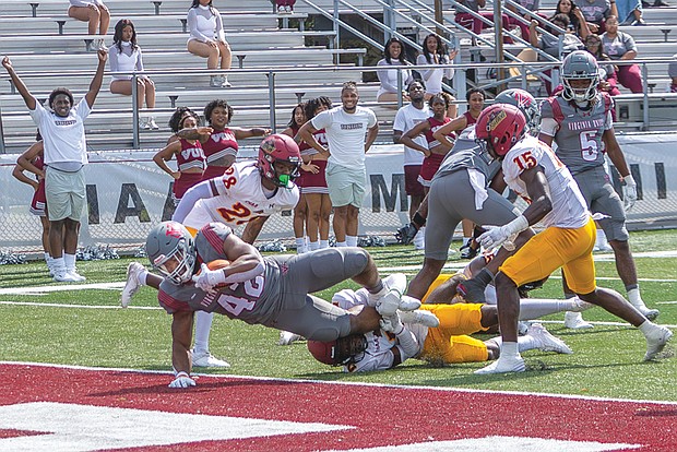 Fullback Jaehlan Joyner (42) dives into the end zone for a touchdown. The Virginia Union Panthers would go on to defeat the Shaw University Bears 42-7.