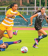 Y-Van Nguyen, left, fights off an opponent’s attempt to slow her pace as VCU extended its unbeaten streak to five games in the 1-1 draw against St. Bonaventure at Sports Backers Stadium.