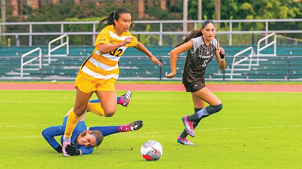 Y-Van Nguyen, left, fights off an opponent’s attempt to slow her pace as VCU extended its unbeaten streak to five games in the 1-1 draw against St. Bonaventure at Sports Backers Stadium.