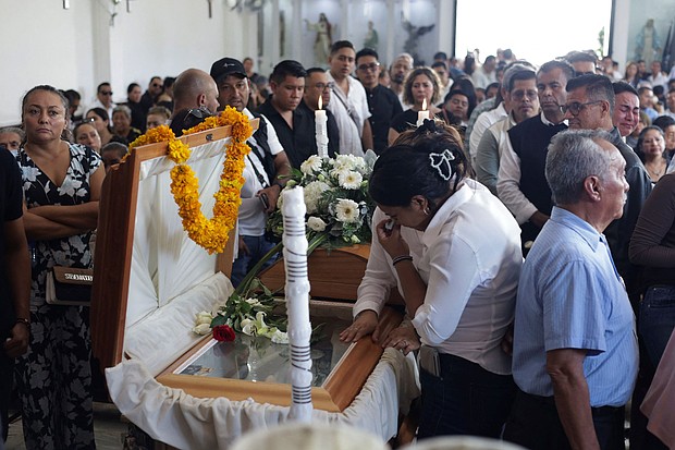 Mourners pay their respects at the casket of Alejandro Arcos, the mayor of Chilpancingo who was killed on Sunday less than a week after taking office.
Mandatory Credit:	Oscar Ramirez/Reuters via CNN Newsource