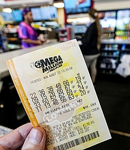 A Mega Millions ticket will cost $5 next year.
Mandatory Credit:	Mike Stewart/AP via CNN Newsource
