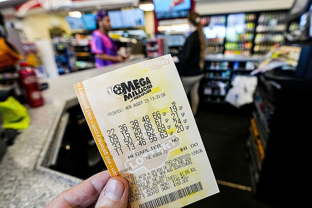 A Mega Millions ticket will cost $5 next year.
Mandatory Credit:	Mike Stewart/AP via CNN Newsource
