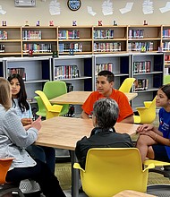 CIS CEO Lisa Descant and Lourdes Jimenez with Spring Forest Middle School students Heidi, Angel and Karla