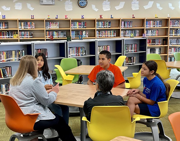 CIS CEO Lisa Descant and Lourdes Jimenez with Spring Forest Middle School students Heidi, Angel and Karla