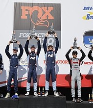 Hyundai drivers Preston Brown, Denis Dupont, Mark Wilkins and Mason Filippi are photographed during podium celebrations for the Fox Factory 120 at Michelin Raceway Road Atlanta in Braselton, Ga., Oct. 11, 2024. (Photo/Bryan Herta Autosport/LAT)