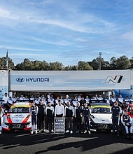 Hyundai team members are photographed after securing the Manufacturers’ Championship at Michelin Raceway Road Atlanta in Braselton, Ga., Oct. 11, 2024. (Photo/Bryan Herta Autosport/LAT)