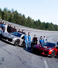 Members of the Corvette team, including General Motors President Mark Reuss on the track in Papenburg, Germany. Preproduction models shown. Actual production model may vary.
