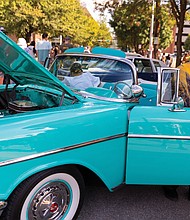 Derrick Banks steps out of his 1957 Chevy Bel Air Convertible that he displayed at the 2nd Street Festival.