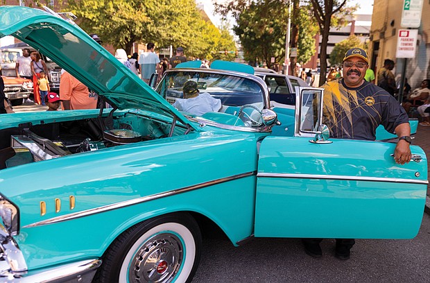 Derrick Banks steps out of his 1957 Chevy Bel Air Convertible that he displayed at the 2nd Street Festival.