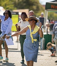 Chesterfield County resident Elida Karyshym dances to Latin folk music performed by Kadencia during the 2nd Street Festival.