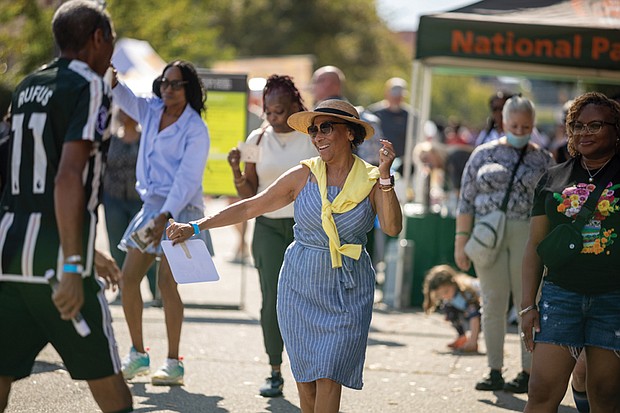 Chesterfield County resident Elida Karyshym dances to Latin folk music performed by Kadencia during the 2nd Street Festival.