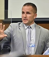 Former Louisville Police officer Brett Hankison responds to his defense attorney March 2, in Louisville, Ky.