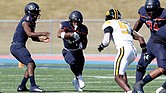 Virginia State University’s offense dominates during their 38-17 homecoming win against Bowie State. Running back Jimmyll Williams (#28) charges up the field as the Trojans amassed 457 yards of total offense.