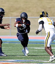 Virginia State University’s offense dominates during their 38-17 homecoming win against Bowie State. Running back Jimmyll Williams (#28) charges up the field as the Trojans amassed 457 yards of total offense.