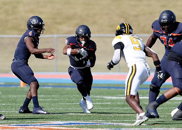 Virginia State University’s offense dominates during their 38-17 homecoming win against Bowie State. Running back Jimmyll Williams (#28) charges up the field as the Trojans amassed 457 yards of total offense.