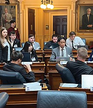 College students from nine Virginia universities gather recently at the State Capitol for a weekend to learn about the legislative process through a government simulation.