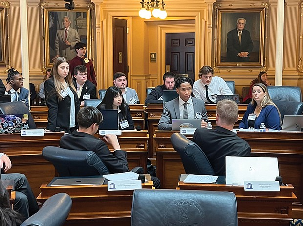 College students from nine Virginia universities gather recently at the State Capitol for a weekend to learn about the legislative process through a government simulation.