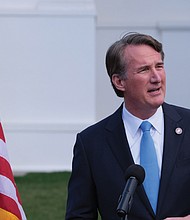 Virginia Gov. Glenn Youngkin speaks to reporters outside the Capitol during the 2024 General Assembly session.