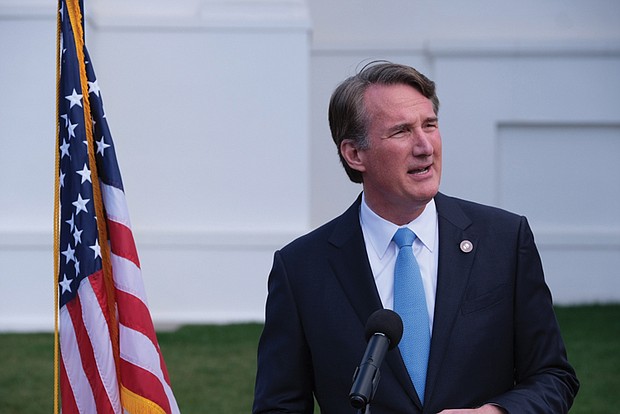 Virginia Gov. Glenn Youngkin speaks to reporters outside the Capitol during the 2024 General Assembly session.