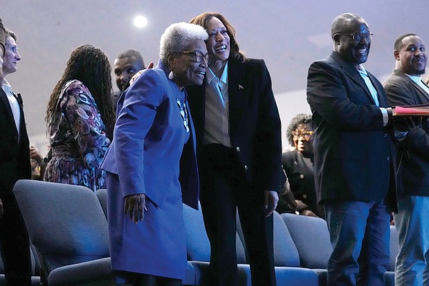 Democratic presidential nominee Vice President Kamala Harris, right, hugs former Rep. Eva Clayton of North Carolina during a church service Oct. 13 at Koinonia Christian Center in Greenville, N.C.