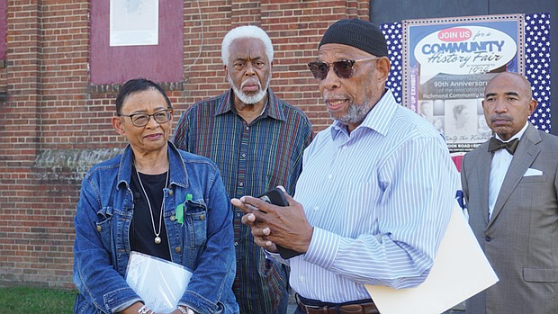 From left, Viola Baskerville, Leonard Edloe and Gary Flowers look on as Sa’ad El-Amin, center, speaks during a press conference Tuesday on a lawsuit seeking to prevent Virginia Union University’s demolition of the Richmond Community Hospital building on the hospital’s front lawn.