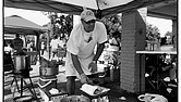 Richard Walker cooks at a fish fry in Gilpin Court in Richmond. He was using the event to help former convicts with prior felony convictions restore their voting rights.