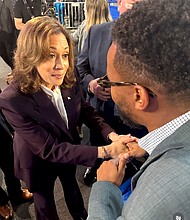 Kamala Harris speaking with Dexter McCoy