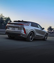 Rear 3/4 view of the 2026 LYRIQ-V in Magnus Metal Frost. Preproduction model shown. Actual production model will vary. Magnus Metal Frost exterior color is extremely limited and late availability.