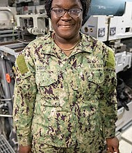 Seaman Nya Davis/Photo by Mass Communication Specialist
Seaman Whitten Helton