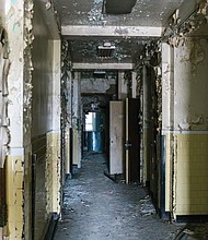 The condition of a dilapidated hallway inside the former Richmond Community Hospital, as seen in 2019.