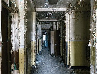 The condition of a dilapidated hallway inside the former Richmond Community Hospital, as seen in 2019.