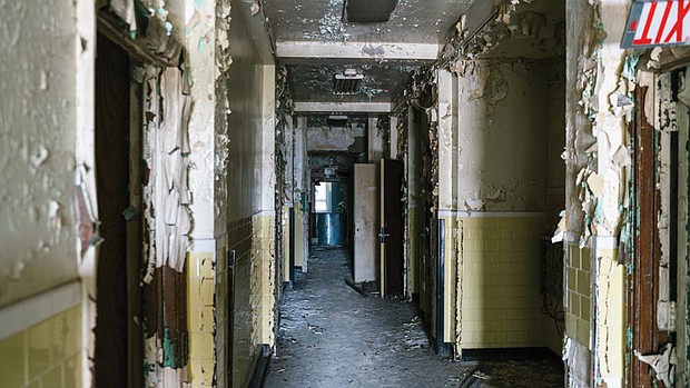 The condition of a dilapidated hallway inside the former Richmond Community Hospital, as seen in 2019.