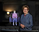 Holocaust survivor Halina Zimm stands next to her interactive image in the Alan and Halina Zimm Theater of Remembrance at the Virginia Holocaust Museum where visitors can engage with her powerful story.