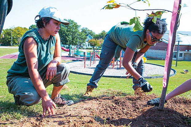 Members of South ReLeaf during a recent tree-planting event at James H. Blackwell Elementary School.