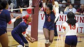 Virginia State players celebrate a key point during a recent match. The Trojans’ teamwork led them to a weekend sweep over Lincoln and Shaw, snapping Shaw’s conference winning streak.