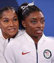 Three years earlier, Jordan Chiles and Simone Biles look on during the same event in July 2021, at the Tokyo Olympics.
Mandatory Credit:	Laurence Griffiths/Getty Images via CNN Newsource