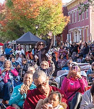 Hundreds attend the block party celebration on 1st Street between Clay and Marshall to commemorate Mama J’s restaurant’s 15 years in Jackson Ward.