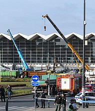 People and rescuers gather at the scene.
Mandatory Credit:	AP via CNN Newsource