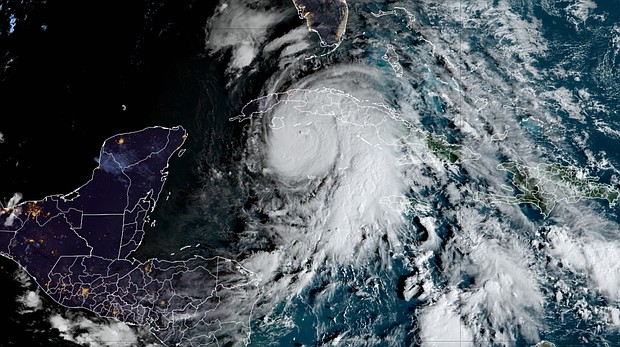 Hurricane Rafael is rapidly intensifying as it closes in on Cuba and the Gulf of Mexico
Caption:	Rafael strengthens in the northwestern Caribbean Wednesday morning.
