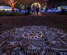 Rangoli art displayed at Diwali in Lewis Ginter Botanical Garden. Traditionally created during Hindu festivals like Diwali and milestone celebrations, Rangoli is believed to invite blessings.