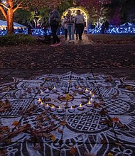 Rangoli art displayed at Diwali in Lewis Ginter Botanical Garden. Traditionally created during Hindu festivals like Diwali and milestone celebrations, Rangoli is believed to invite blessings.