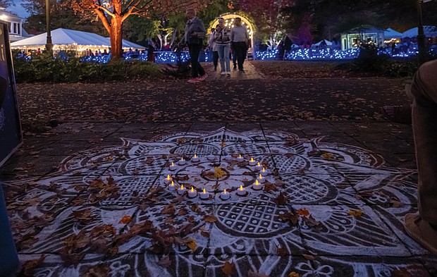 Rangoli art displayed at Diwali in Lewis Ginter Botanical Garden. Traditionally created during Hindu festivals like Diwali and milestone celebrations, Rangoli is believed to invite blessings.