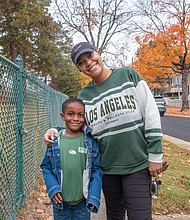 Avonte Richardson, 6, shows off his mother’s “Just Voted” sticker after she voted at Swansboro Elementary School. Mom Brinae Jackson joined a steady flow of voters at Swansboro Elementary School on Election Day.