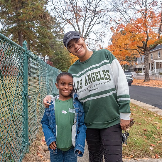 Avonte Richardson, 6, shows off his mother’s “Just Voted” sticker after she voted at Swansboro Elementary School. Mom Brinae Jackson joined a steady flow of voters at Swansboro Elementary School on Election Day.