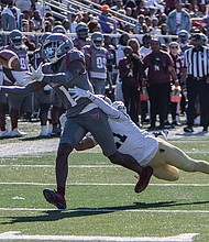Reginald Vick Jr. hauls in a reception from Mark Wright as Virginia Union University crushes Bluefield State University 91-0, tying a 108-year-old record Saturday, Nov. 2, at Hovey Stadium.