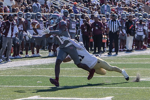 Reginald Vick Jr. hauls in a reception from Mark Wright as Virginia Union University crushes Bluefield State University 91-0, tying a 108-year-old record Saturday, Nov. 2, at Hovey Stadium.