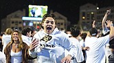 Colorado fans storm the playing field after Colorado’s overtime victory over Baylor in an NCAA college football game Saturday, Sept. 21, in Boulder, Colo.